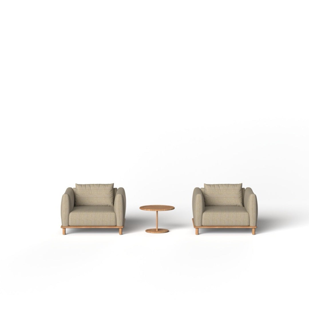 Two beige armchairs with a small round table on a white background
